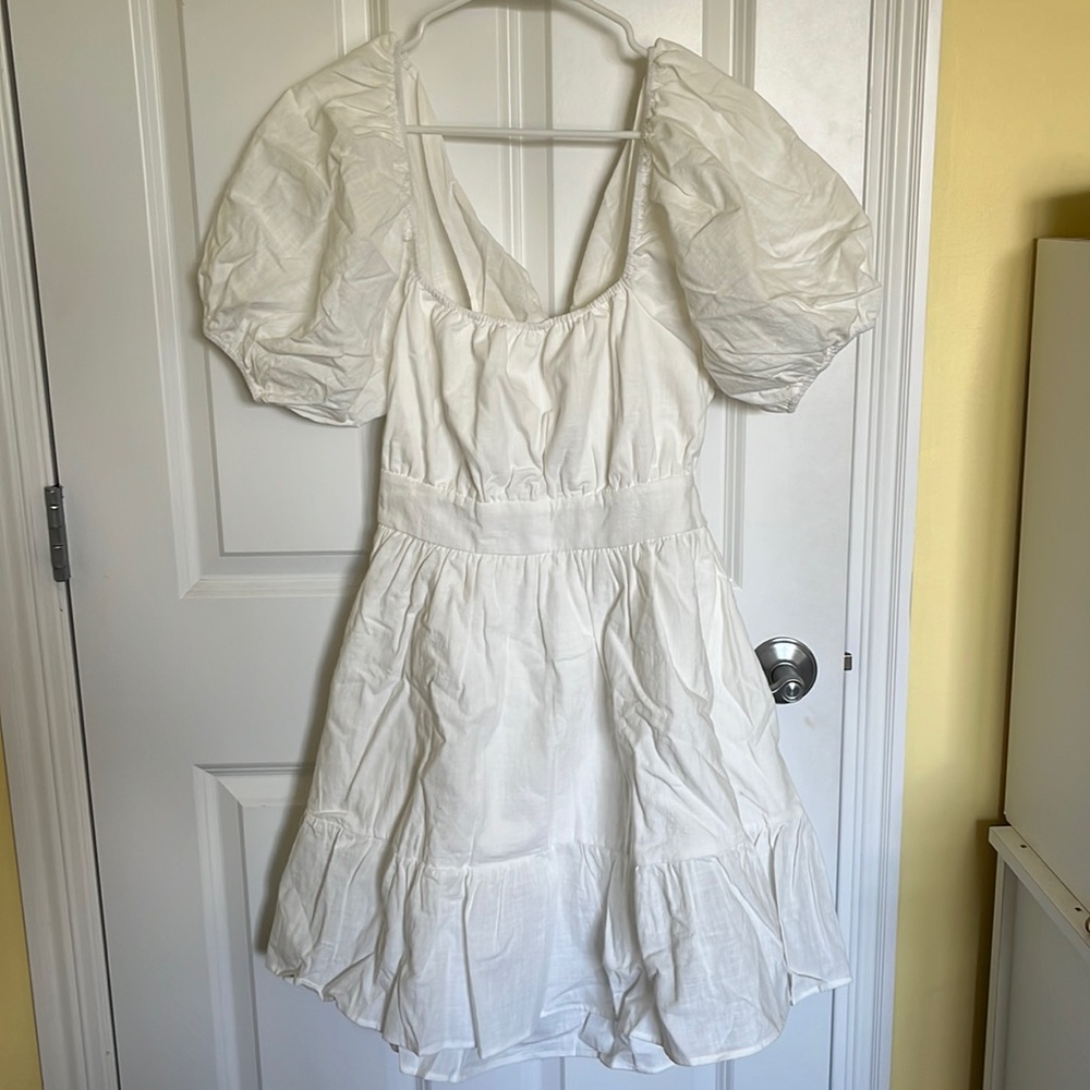 White babydoll dress w/ bow tie in back and cutout detail
